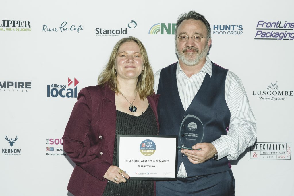 Guy and Annie at the awards ceremony, holding the plaque for Best B&B in the South West